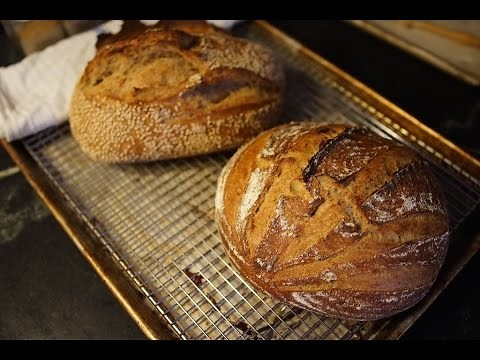 Loading bread into dutch oven and clay baker
