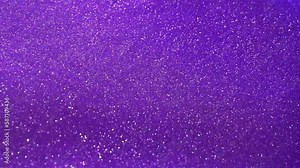 Shiny Dust Particles in Slow Motion in a Purple Fluid. Silver sparkling particles in a purple liquid, creating stunning patterns and dispersion effects. Stock Video
