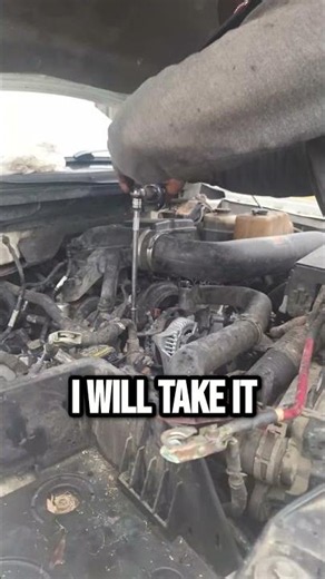 Mechanic braves the rain for car repair fix #shorts