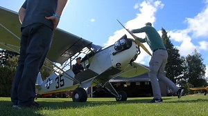 Watch a pilot start a 90 year old aircraft by hand