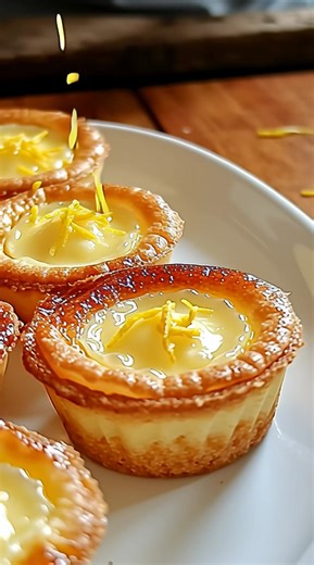 🍋🥧 Baby Lemon Impossible Pies — Delightfully Tangy & Effortlessly Elegant! 🥧🍋 These mini lemon pies bake up with a creamy, custard-like filling and magically form their own tender crust. Perfectly portioned in mini muffin tins, they offer a refreshing burst of lemon with just a hint of sweetness. Serve chilled or at room temperature for a light, impressive dessert that’s quick and fuss-free. Ingredients 🍽️ ½ cup all-purpose flour 1 cup sugar 2 eggs ¼ cup melted butter 2 tbsp lemon juice 1 t