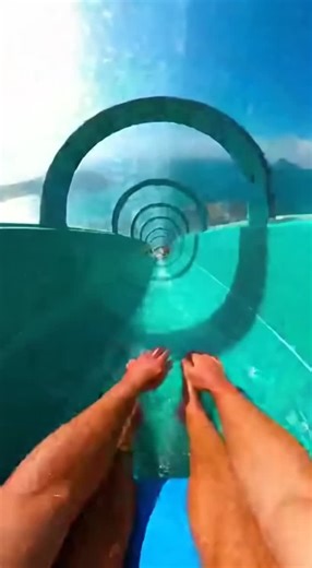 The News Does Not Exist on Instagram: "Hold your breath as reality blurs into pure adrenaline! 💦 Experience the ultimate rush through this hyper-realistic mega water slide adventure. Every splash, every heart-stopping transparent section hundreds of feet above paradise, every twist through vibrant tubes captured in breathtaking first-person perspective. Have you ever experienced a water slide that made your stomach drop? Tell me your most extreme water park memory! 👇 #ExtremeThrills #POVAdvent