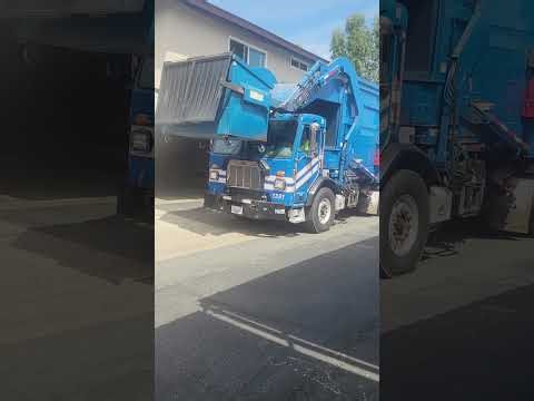 Republic services garbage truck on early morning trash collection filmed today with a horn