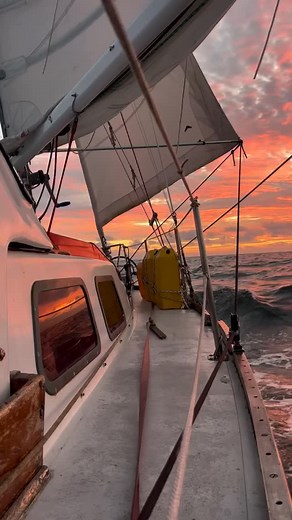 No trending music - just @james.the.sailor.man on SV Triteia sailing under red skies 🌅 | PredictWind