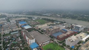 the Export Processing Zone (EPZ) of Dhaka with polluted river on a foggy day in Bangladesh