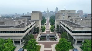 Government buildings and complex at Michigan state capitol building. Aerial establishing shot of luxurious grounds during dangerous air quality in Lansing, MI. Pollution and forest fires theme.