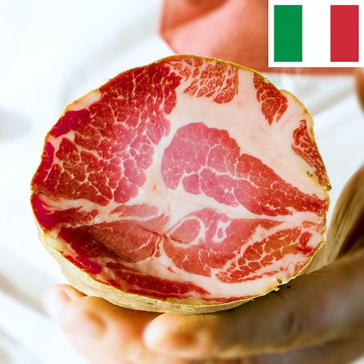 You may know it by the name of capocollo, coppa, capicola, gabagool — dozens of names to describe one Italian delicacy: a distinctive cured meat made from pork neck, easy to spot thanks to its vivid red color and beautiful marbling. | Insider Food