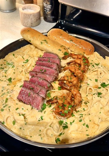 The flu took me out for a minute but we’re back babyyy 😭 The first thing I was craving.. Blackened Steak & Shrimp Alfredo with Olive Garden-Style Breadsticks 🥩🍤🍝🥖 🥖 OLIVE GARDEN-STYLE BREADSTICKS 1 Cup 3 Tbsp Warm Water 1¼ Tsp Active Dry Yeast 2 Tbsp 1 Tsp Sugar 3 Tbsp Olive Oil 3 Cups All-Purpose Flour 2 Tsp Salt Topping: Butter Fresh Parsley Salt Garlic Powder Black Pepper 425°F for 10–13 minutes. 🍤 SHRIMP Cajun Seasoning Paprika Onion Powder Garlic Powder Black Pepper Juice of 1 Lemon 