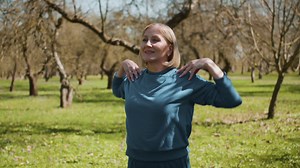 Free stock video - Woman stretching outdoors