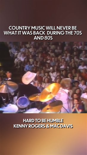 Mac Davis singing his song 'Hard to be a Humble' live during a Kenny Rogers concert in the 80's. | Country Ain't Country Anymore