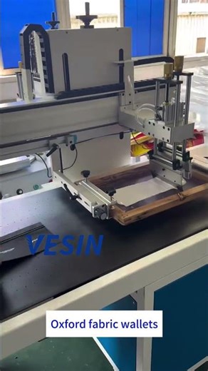 High-speed screen printing machine for Oxford fabric wallets! Perfect for mass production.