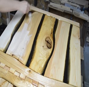 Folding table In this video I demonstrate the process of making a folding table for my living room. It was made from ash tree boards. The gaps are filled with epoxy resin. In total I spent two weeks on this project. The result is worth the effort though. Thank you for watching! | Woodworking Tools