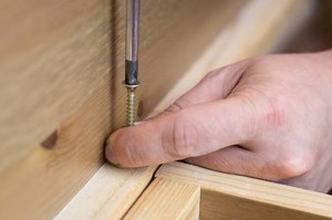 How do I Install the Cam Lock on a Cabinet