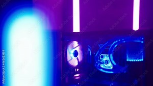 Beautiful gamer blue RGB water cooler PC surrounded with neon lights 4K