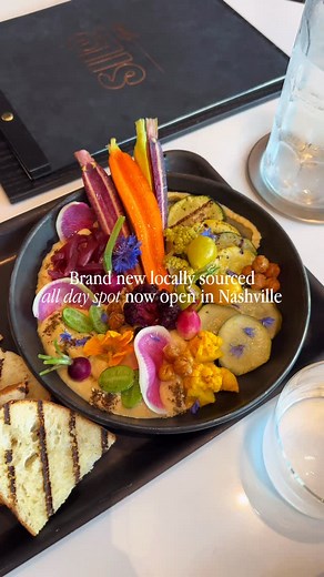Where To Eat In Nashville on Instagram: "Say hello to this BRAND NEW all-day restaurant in Nashville, located in the heart of the Gulch and it’s all about locally sourced everything 🥕🥬🍅 Welcome to @silonashville Executive Chef David Henriquez is behind the menu, and you can taste the intention in every bite. The space is STUNNING, airy, plant-filled, and super laid-back, whether you’re grabbing coffee or settling in for dinner. We started with the hummus and pickled veg, 