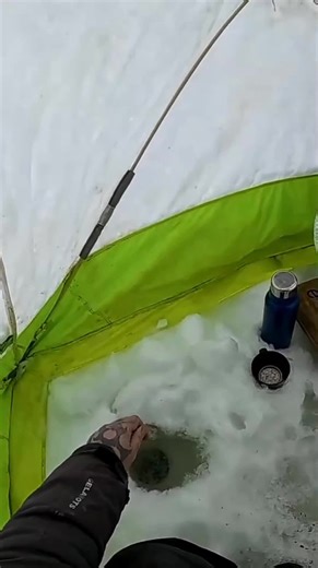 Ice fishing in winter with a rod! In a tent with the stove on. #tent #fishingrod #fishing #fishingislife #fishingtiktoks #fishinggear