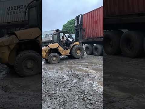 Rough Terrain Forklift Manitou Unloading Containers. Part 1.