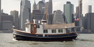 This Tiny Renovated NYC Tugboat Contains a Full Cottage Home
