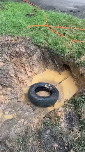 This Clever Culvert Cleaning Trick Uses Old Tires