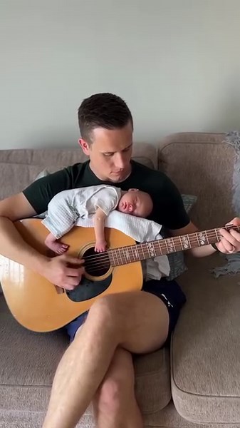 77K views · 2.2K reactions | Here from Ireland is Eoin Maneely from the great Irish folk band The Knights playing a relaxing tune as his lovely baby son Cillian sleeps on his guitar! A beautiful video! | The Music Man | Facebook