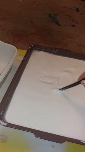 Mixing the Elmer's glue and water mixture