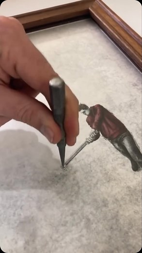 Architecture & Design on Instagram: "@AndrewScott_Art is known for his distinctive art style, using tools like hammers and chisels to alter frames and create dynamic scenes. His broken glass method brings characters to life, often showing them interacting or breaking free. Inspired by editorial illustrators and street artists, Scott’s work includes visual surprises and symbolic twists. He typically uses shades of gray with touches of red, exploring themes like hope, struggle, and introspection, 