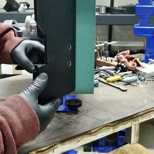 The AmeriBrade 272 grinder work rest can be used in two positions, one horizontal and one vertical. Simply pull the work rest out, rotate it counter clockwise 90 degrees and spin the work rest around. On the bracket use what ever hole suits your needs 😉 #edcknife #knifemaker #ameribrade #2x72beltgrinder #knifegrinder #knives | AmeriBrade