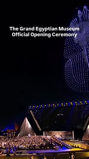 Under the night sky at Giza, the opening of the Grand Egyptian Museum became more than a ceremony, it became a spectacle of history in motion. As an orchestra filled the air with Egyptian melodies, thousands of drones lit up the horizon, forming the iconic gold mask of Tutankhamun and his royal chariot in three dimensional flight. At the same time, the museum’s interior glowed in synchronized lighting, and a silent procession of torch bearers advanced through the halls, their lanterns casting wa