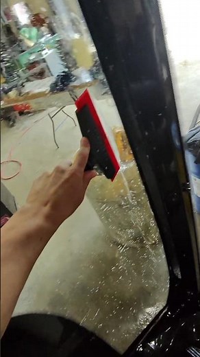 Applying window tint to a tractor windshield