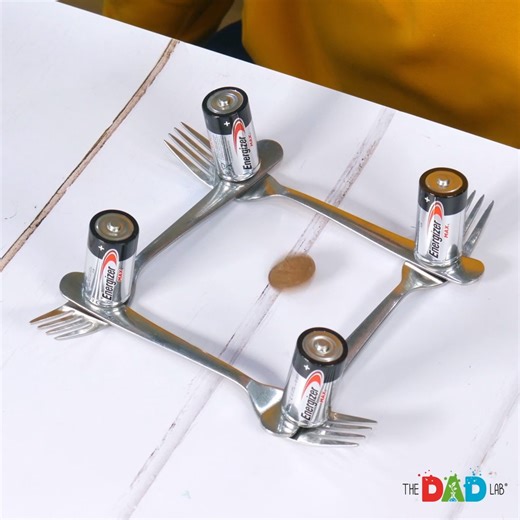 The experiment looks so simple, and with batteries involved, you might think that it could work. However, it is just a trick! For electricity to start flowing, both ends of a battery have to be connected to the circuit, but, as you can see, only one side is touching the fork. Of course, we could connect batteries appropriately, except the coin would not spin anyway. #TheDadLab #scienceexperiment #science | TheDadLab