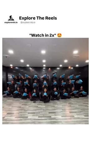 Explore The Reels on Instagram: "This mesmerizing visual isn’t just a dance routine — it’s a carefully engineered form of synchronized visual art where movement, geometry, and coordination blend to create a single living structure. What you’re seeing is a group of performers using identical blue props, likely umbrellas or hand fans, arranged in precise layers to form patterns that appear almost computer-generated when viewed from the front. This technique, often used in large-scale stage product