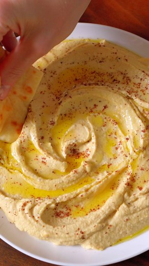 Joanne Gallagher on Instagram: "My favorite hummus recipe! With a few simple tricks, you can make creamy, smooth homemade hummus, and yes, it’s better than store-bought. See how to make hummus (and the full-length 4 minute video) by clicking the link in our bio or Googling “inspired taste hummus” So many of our readers LOVE this hummus recipe and we think you will too! #hummus #hummusrecipe #chickpeas #appetizers"