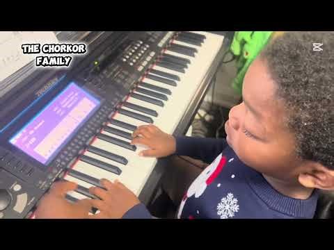 Our 4 year old son learning how to play piano