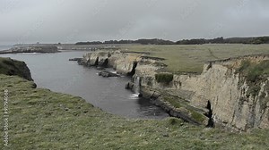 Coastal waterfall and bluffs at Point Arena, California.