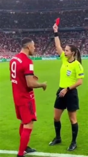Abdullah GÜRPINAR on Instagram: "A Bayern Munich match turns surreal as a female referee shows a red card, the player reacts with a playful air-kiss gesture, and the referee explodes in exaggerated anger, shouting and waving arms while officials rush in, creating absurd Bundesliga comedy and a viral football moment across Europe and the USA. #BayernMunich #Bundesliga #Football #Soccer #ViralFootball #ViralSoccer #FootballComedy #FunnyFootball #Referee #RedCard #StadiumChaos #MatchDay #FootballRe