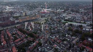 Aerial view arriving at fair showing several funfair attractions and wave swinger is amusement ride that is a variation on the carousel in which the seats are suspended from the rotating summit 4k