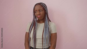 African american woman standing depressed and worry for distress, crying angry and afraid. sad expression. over isolated pink background