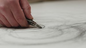 Close up artist hand drawing by pencil on canvas, creating draft, painting. Prores codec. Creativity and art