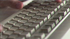 Computer engineer developer is working on old vintage computer 1990s. Antique classic pc keyboard and programmer typing hands. Internet web digital startup history. Outdated retro technology concept