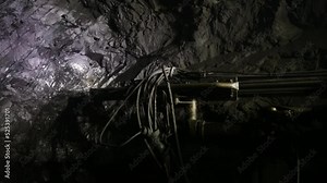 The process of drilling wells in an iron ore mine. Part of the technological process for mining minerals in an underground mine.