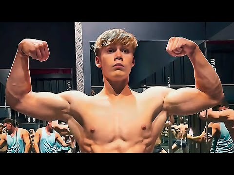 Young bodybuilder George Holland Flexing Muscles