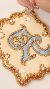 I used the Rose Alphabet cookie cutter set from Cakes N Supplies by Ximena to make a guide for these monogram cookies. The luster dust and edible glue create an enameled look, inspired by a trinket box that my grandmother gave to me 🥰 You'll find all of my cookie and icing recipes in the Cookie Art Club! | SweetAmbs