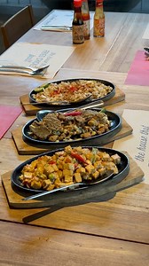 Add some sizzle to your day with Max’s sizzling dishes! Take a bite of our Crispy Pork Sisig, Crispy Bangus Sisig, and our signature Sizzling Tofu! Available for dine-in, takeout, and delivery! | Max's Restaurant