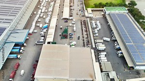 Organized Chaos: The aerial view captures the controlled chaos of a distribution center, where countless packages are sorted and dispatched in a symphony of movement.