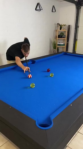 Mastering Pool Techniques on a Blue Table