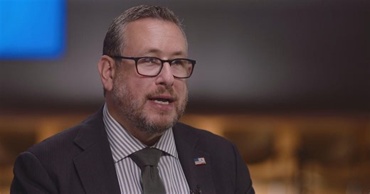 Immigration official on visa applicant scrutiny