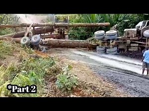 Logging truck accident heavy recovery by wheel loader