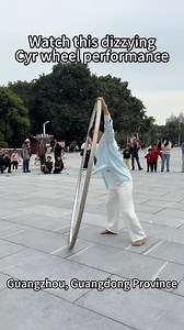 A young dancer spins and gyrates inside a giant steel hoop – known as a Cyr wheel, showcasing jaw-dropping balance and effortless grace in #Guangzhou. #TrendinginChina | Xi's Moments