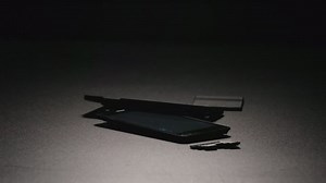 clip-1080688040-slow-motion-smartphone-falls-breaks-on-parts