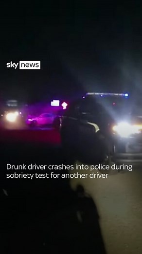Bodycam footage shows the shocking moment a drunk driver crashes into police during a sobriety test for another driver. Both drivers were eventually arrested for driving under the influence of intoxicants and nobody was seriously injured. 🔗 Click the link in bio to read more #drunk #driver #police | Sky News